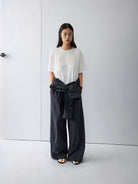 Random Piece Distressed Cotton Blend T Shirt in Charcoal - On Female Model