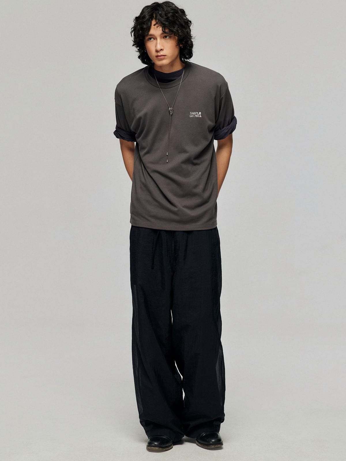 SIMPLE PROJECT Inverted Silver Logo Crewneck T Shirt in Charcoal - On Male Model
