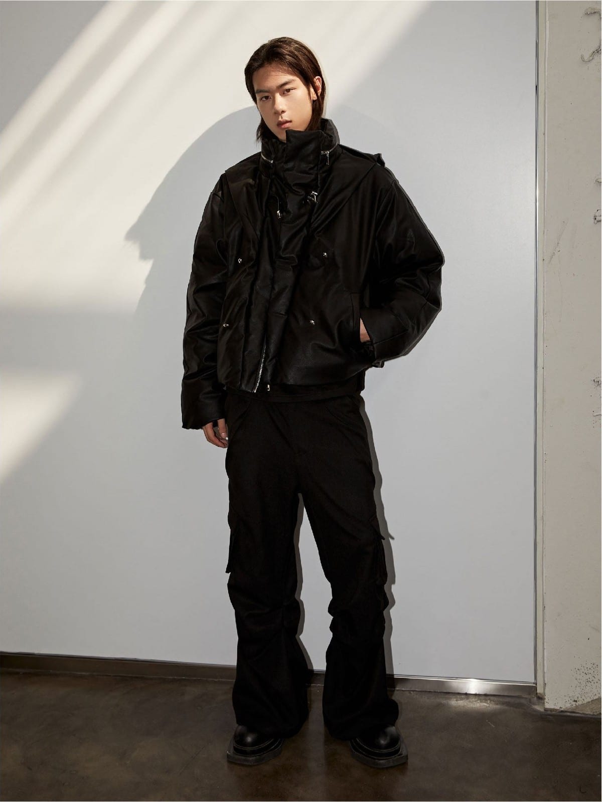 Y OFFICIAL Cropped Faux Leather Down Puffer in Black - On Male Model