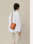 QIUZHEN Leather Drawstring Bucket Bag in Brown - On Model