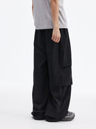 MEDM Crinkled Nylon Parachute Cargo Pants in Black - On Male Model