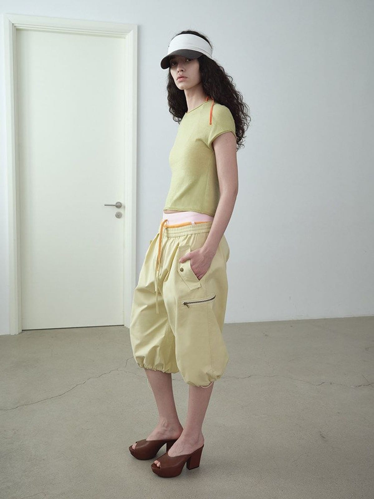 RARELY ALIKE Cropped Cotton Lantern Cargo Shorts in Beige - On Female Model