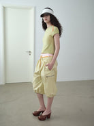 RARELY ALIKE Cropped Cotton Lantern Cargo Shorts in Beige - On Female Model