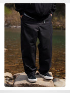 Soda Trendy Belted Cotton Nylon Tapered Pants in Black - On Model