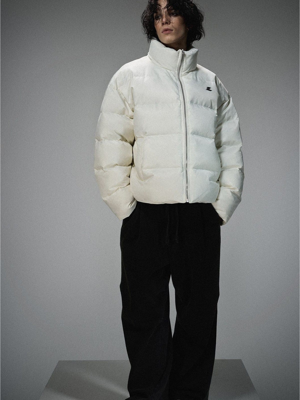 LOSTCTRL Minimalist Nylon Puffer Jacket in Cream - On Male Model