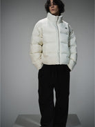 LOSTCTRL Minimalist Nylon Puffer Jacket in Cream - On Male Model