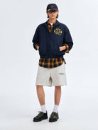 MEDM Nylon Stand Collar Coach Jacket in Navy Blue - On Male Model