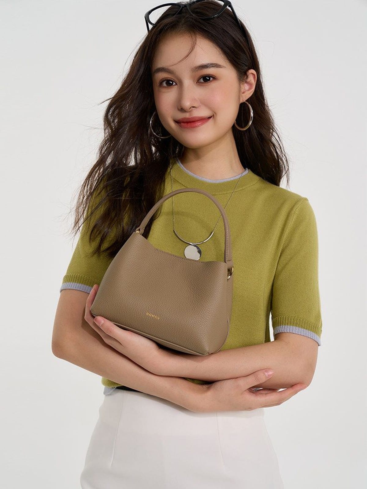 HONGU Cowhide Crossbody Bucket Bag in Taupe - On Female Model