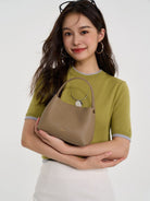 HONGU Cowhide Crossbody Bucket Bag in Taupe - On Female Model