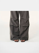 BLINDNOPLAN Contrast Panel Pleated Parachute Pants in Gray - On Model