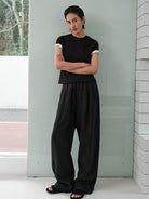 MSBEAST Cotton Blend Tapered Waist T Shirt in Black - On Female Model