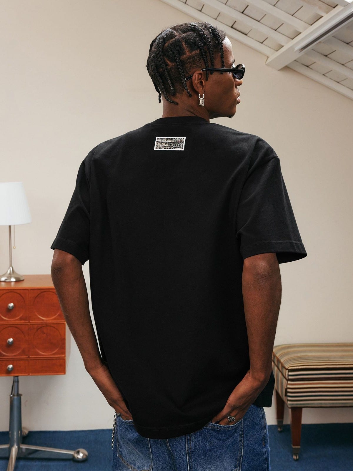 MEDM Pearl Embellished Letter Cotton T Shirt in Black - On Model