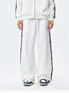 MEDM Lace Paneled Striped Track Pants in White - On Model