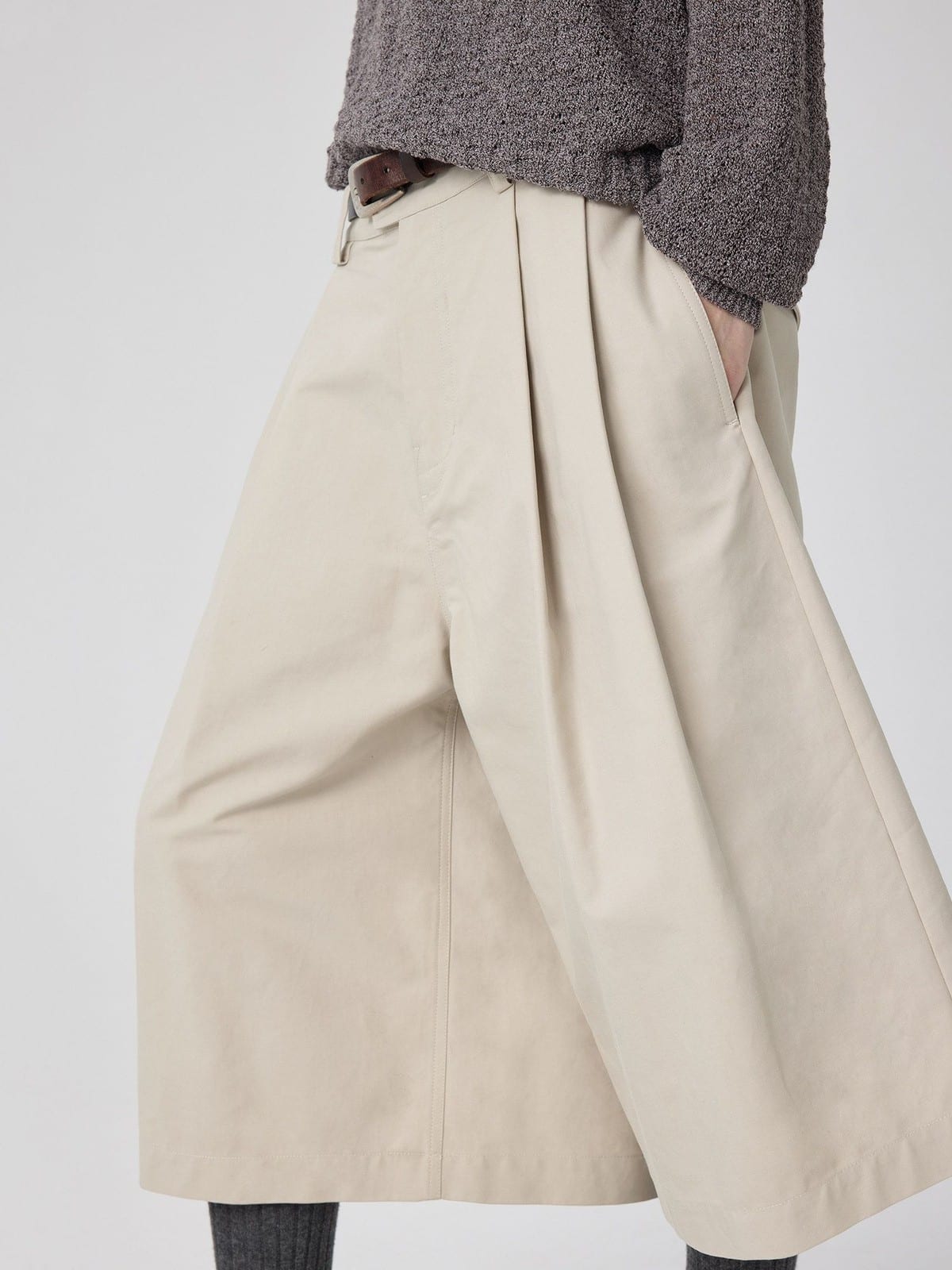 SIMPLE PROJECT Cotton Pleated Cropped Shorts in Beige - On Model