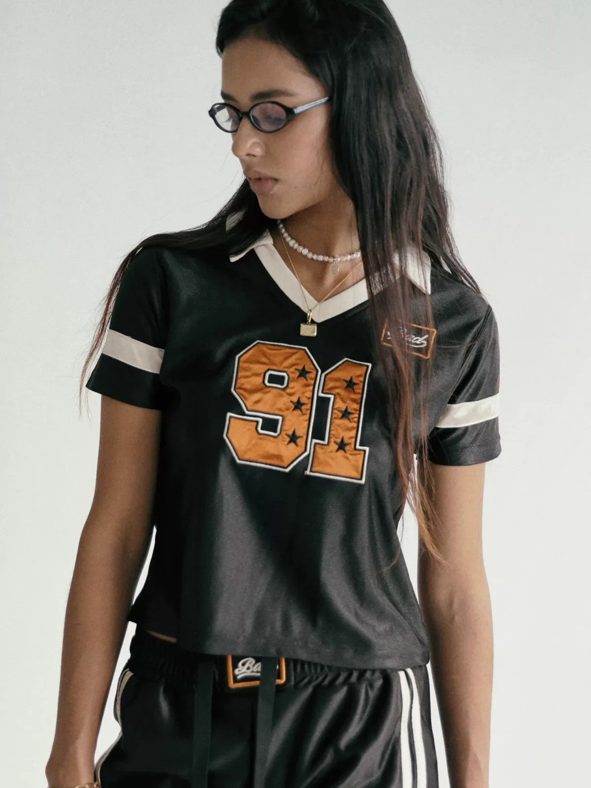 BADSEED Cropped Graphic Baseball Jersey in Black - On Female Model