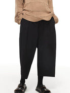 SIMPLE PROJECT Pleated Cropped Wide Leg Trousers in Black - On Model