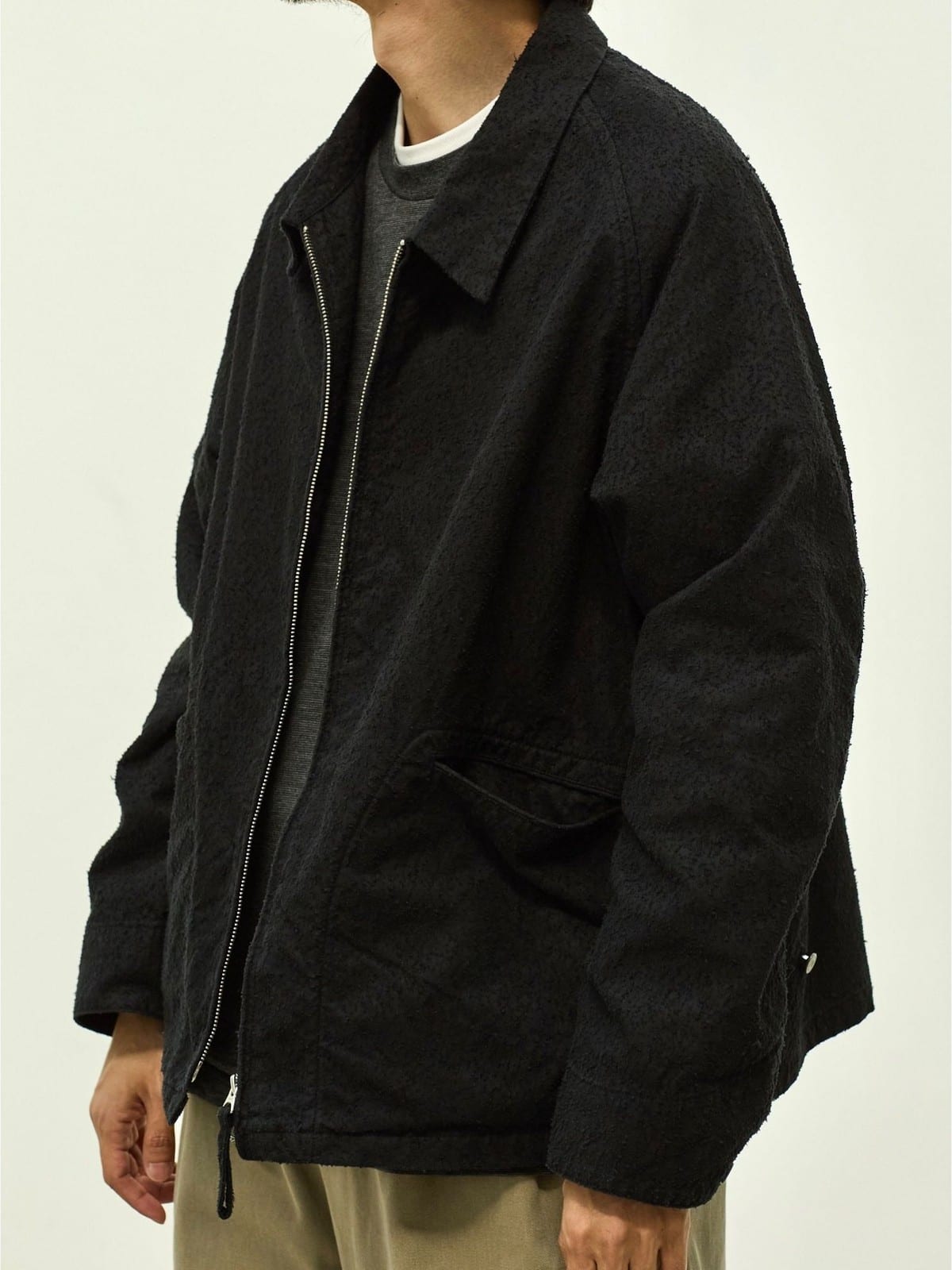 USAGE Textured Nep Blouson Jacket in Black - On Male Model