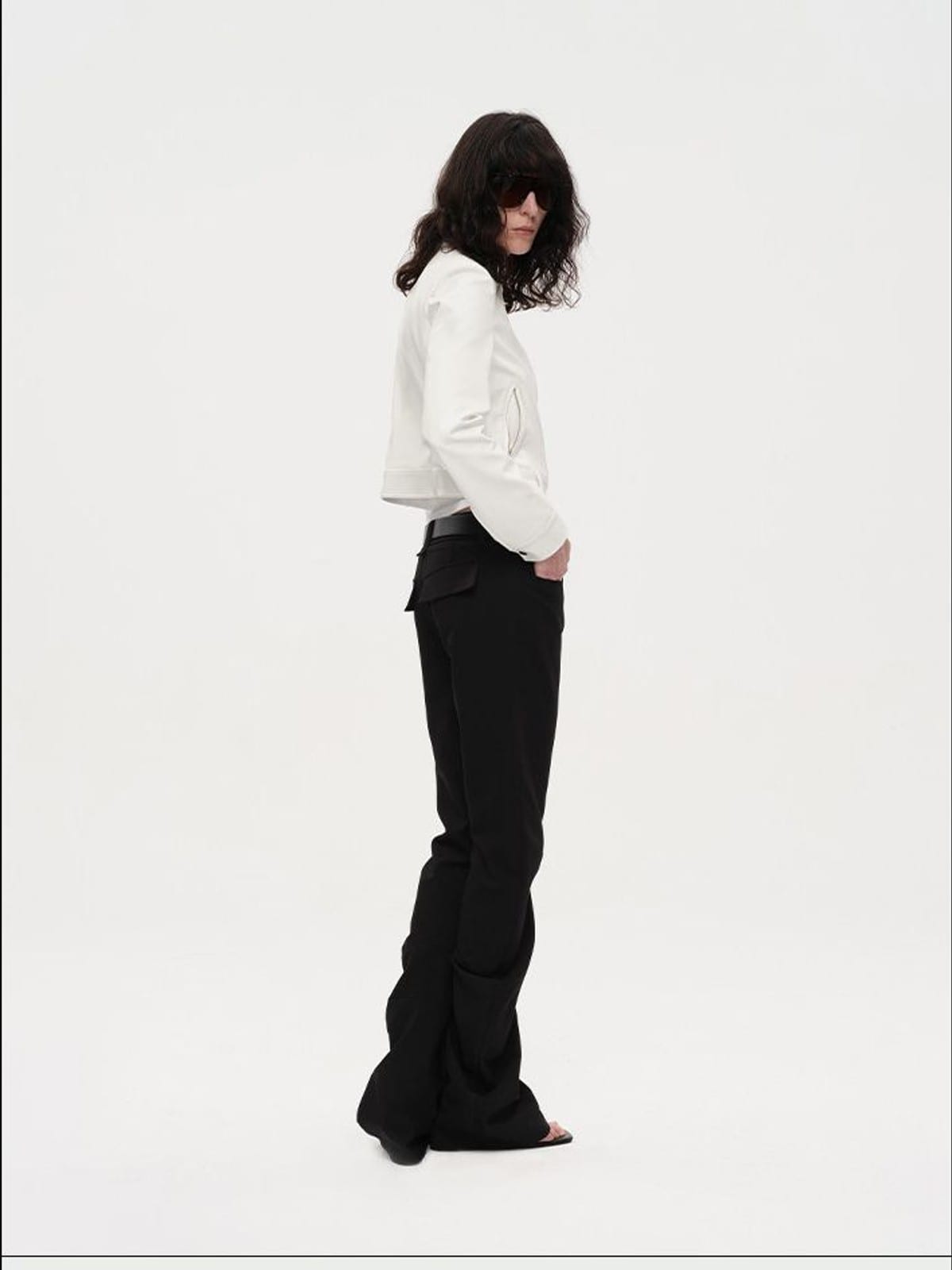 RARELY ALIKE Curved Leg Flared Dress Pants in Black - On Female Model