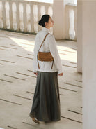 QIUZHEN Vegetable Tanned Leather Camera Bag in Beige - On Female Model