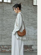 QIUZHEN Vegetable Tanned Leather Crescent Bag in Gray - On Female Model