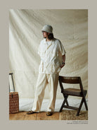 USAGE Vintage Neppy Cotton Straight Leg Jeans in Cream - On Male Model