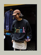 USAGE Washed Cotton Graphic Sweatshirt in Black - On Male Model