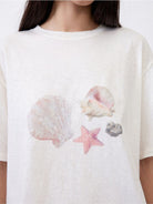 Random Piece Shell Print Cotton Lyocell T Shirt in Cream - On Female Model