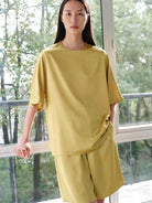 MSBEAST Oversized Acetate Satin T Shirt in Yellow - On Female Model