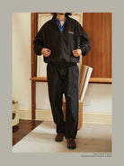 USAGE Heavily Washed Selvedge Denim Jeans in Black - On Male Model
