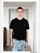 UNKNOWNWORLD Small Logo Cotton T Shirt in Black - On Male Model