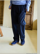 USAGE Pleated Cotton Twill Chinos in Navy Blue - On Model