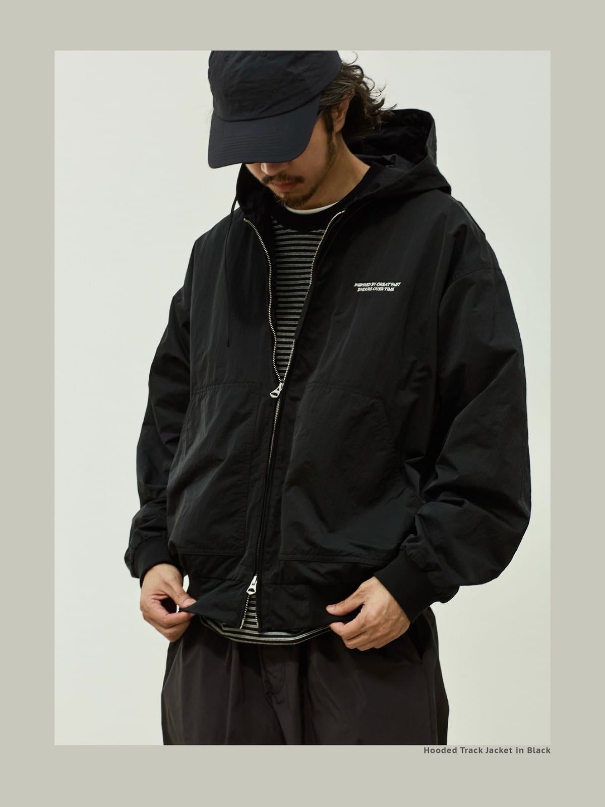 USAGE Crinkle Nylon Hooded Track Jacket in Black - On Male Model