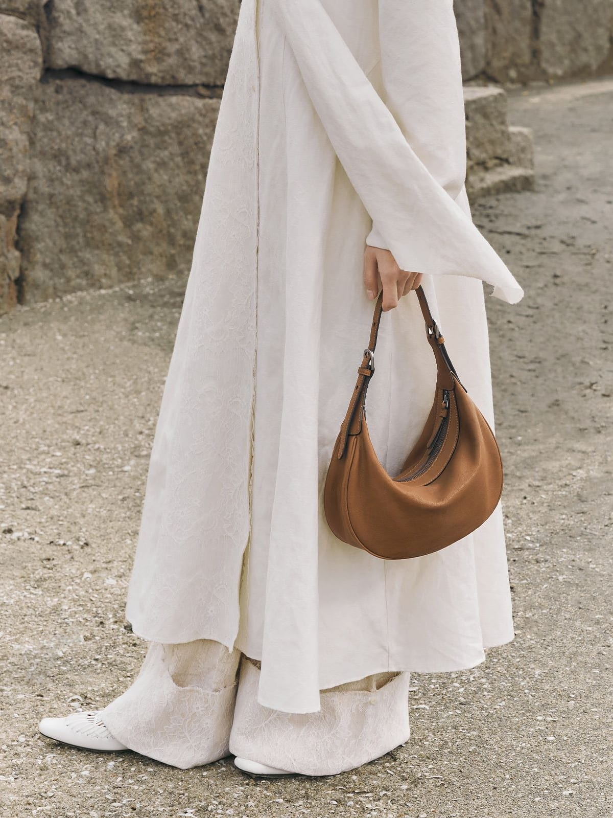 QIUZHEN Vegetable Tanned Leather Crescent Bag in Beige - On Female Model