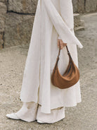 QIUZHEN Vegetable Tanned Leather Crescent Bag in Beige - On Female Model