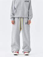 MEDM Fleece Lined Embroidered Sweatpants in Gray - On Model