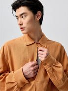 SIMPLE PROJECT Lyocell Ramie Pleated V Neck Shirt in Orange - On Male Model