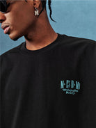 MEDM Letter Embroidery Cotton T Shirt in Black - On Male Model