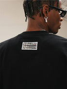 MEDM Pearl Embellished Letter Cotton T Shirt in Black - On Model