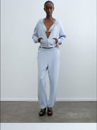 RARELY ALIKE Graphic Cropped Zip Up Hoodie in Sky Blue - On Female Model