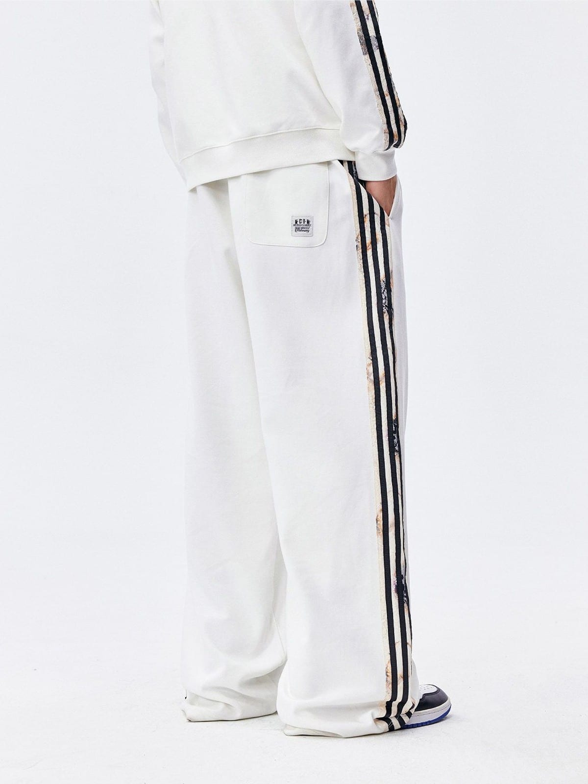 MEDM Lace Paneled Striped Track Pants in White - On Model
