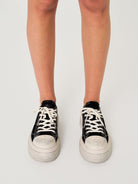 SMFK Distressed Canvas Skate Sneakers in Black - On Model