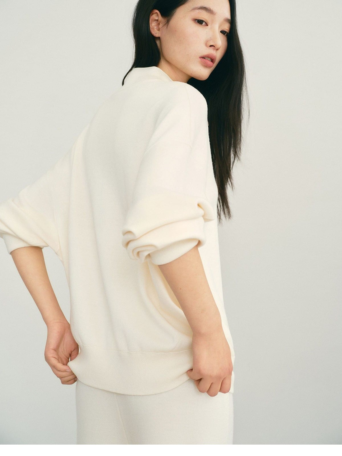 TEASEL Worsted Wool Henley Sweatshirt in Cream - On Female Model