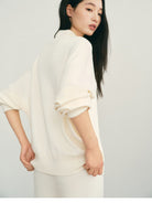 TEASEL Worsted Wool Henley Sweatshirt in Cream - On Female Model