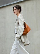 QIUZHEN Vegetable Tanned Calfskin Hobo Bag in Gray - On Female Model
