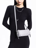 Grotto Pleated Leather Cylinder Bag in Gray - On Female Model