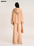 SMFK Cross Embroidered Cotton Zip Up Hoodie in Beige - On Model