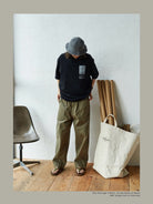 USAGE Air Spun Cotton Graphic T Shirt in Black - On Male Model