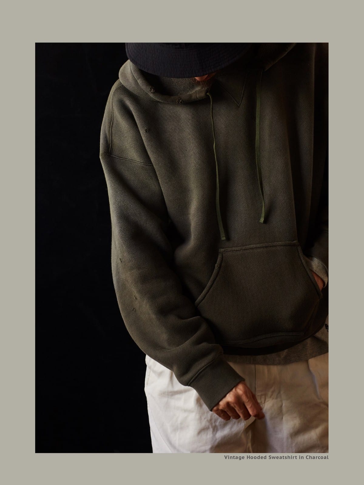 USAGE Faded Vintage Wash Hoodie in Olive - On Male Model