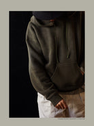 USAGE Faded Vintage Wash Hoodie in Olive - On Male Model