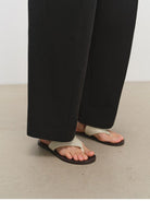 MSBEAST Cotton Blend Tapered Cropped Trousers in Black - On Model